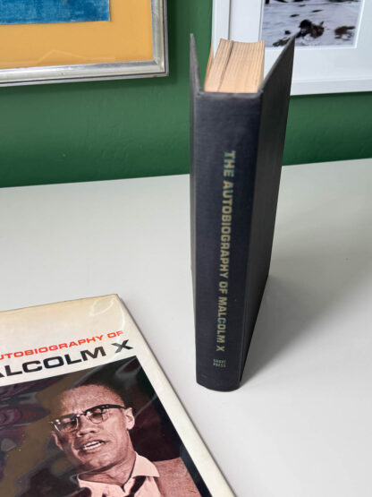 Various pictures of the 4th printing of Autobiography of Malcolm X published by Grove Press in 1965.