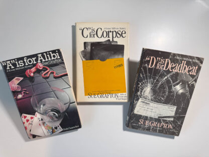 a photo of three books: A is for Alibi, C is for Corpse, and D is for Deadbeat.