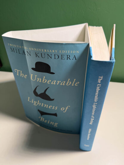 various pictures of the Milan Kundera book The Unbearable Lightness of Being