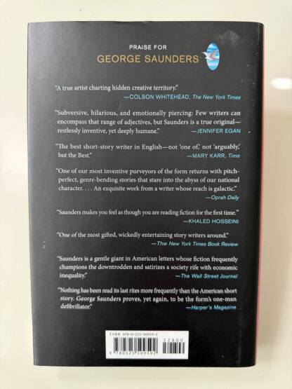 Various pictures of the signed first edition of George Saunders book Liberation Day