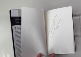 Various pictures of the signed first edition of George Saunders book Liberation Day