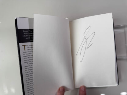 Various pictures of the signed first edition of George Saunders book Liberation Day